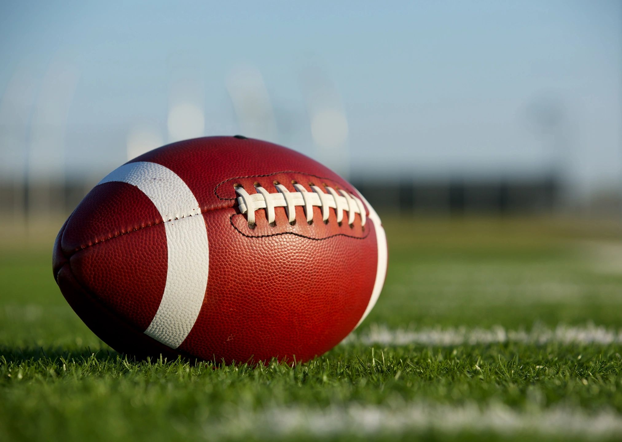 American football on grass field
