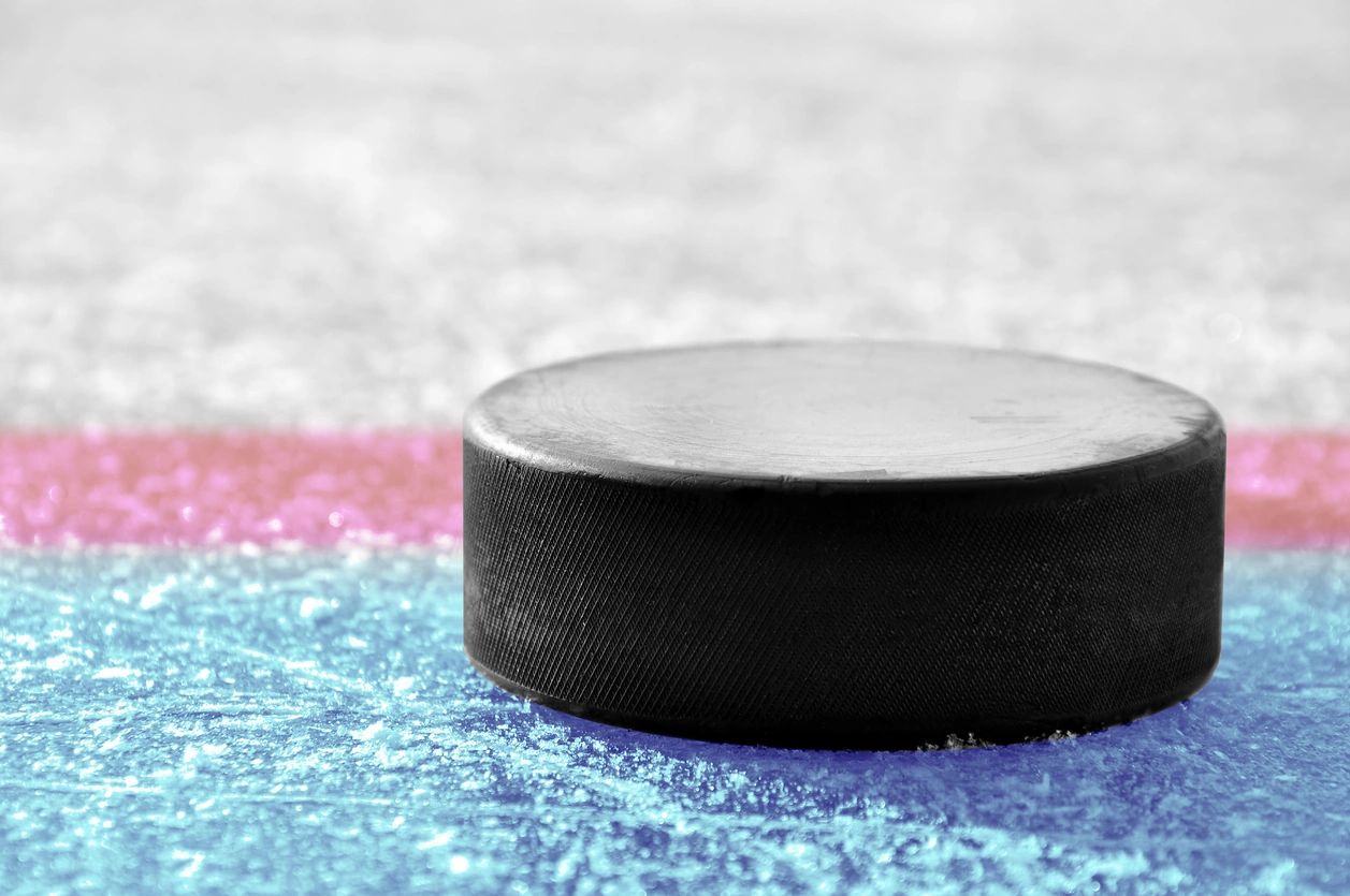 Hockey puck on ice rink